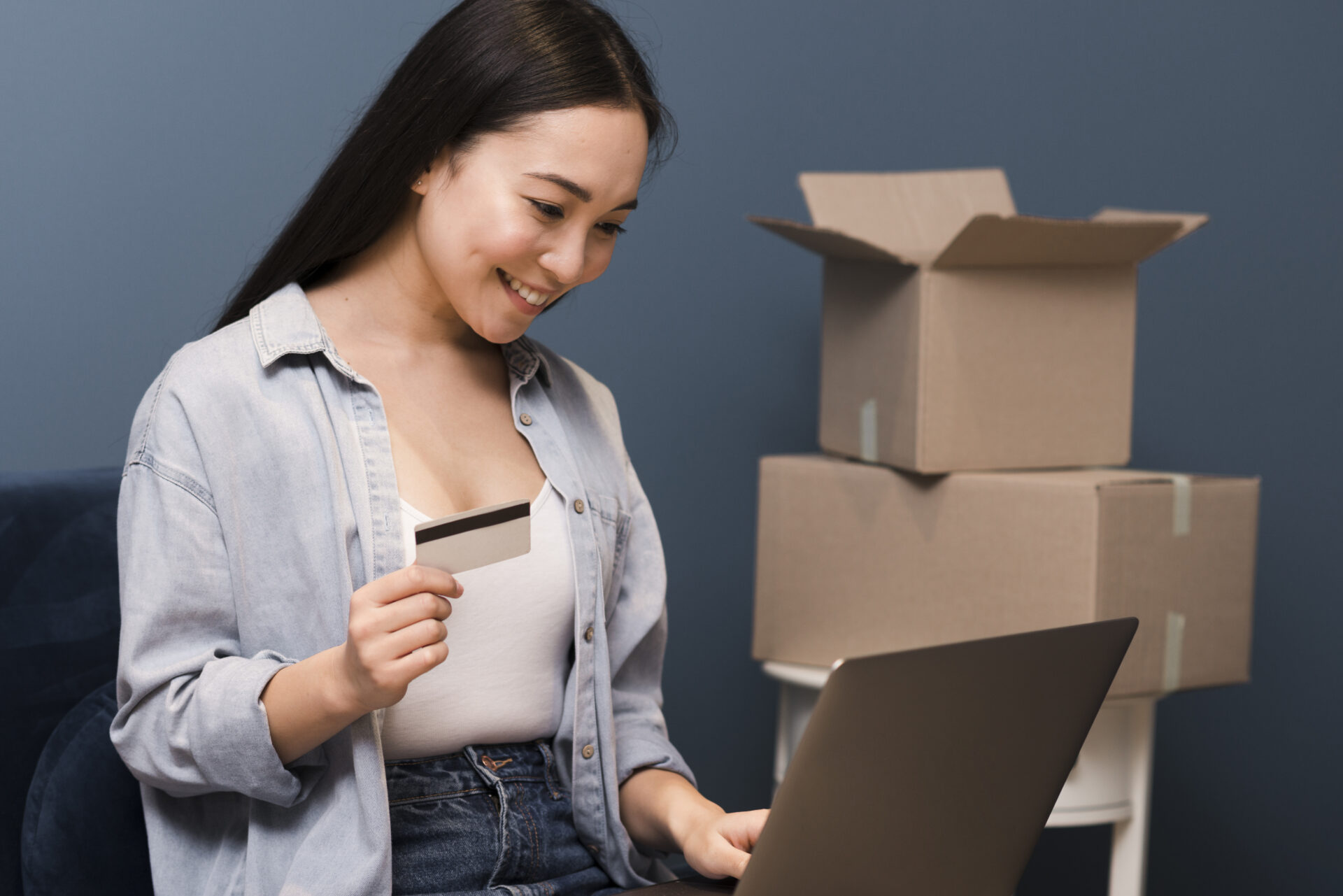 side view smiley woman doing some online purchasing